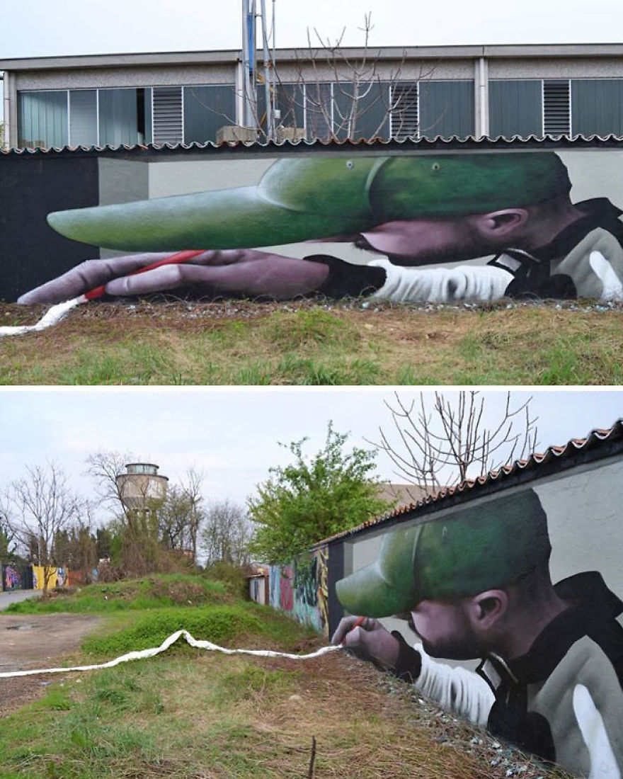 A clever and dynamic 3D mural by Cosimo Cheone Caiffa depicting a man in a green cap leaning forward to draw a white line that extends from the mural onto the ground. The painted figure is rendered in stunning realism, creating the illusion that he is actively interacting with the real environment. The white line seamlessly connects the wall and the ground, guiding the viewer's eye through the artwork and the natural surroundings. This piece exemplifies Cheone's ability to blend painted and physical elements, transforming an ordinary space into an immersive art experience.