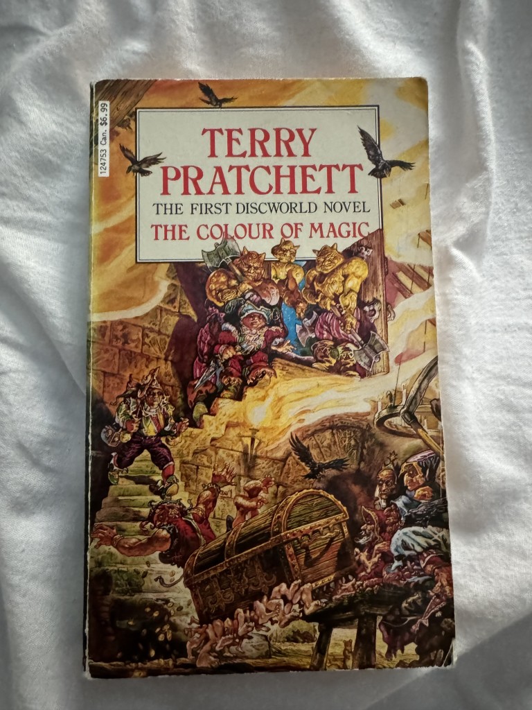 Picture the cover of the paperback edition of Terry Pratchett’s ‘The Colour of Magic’