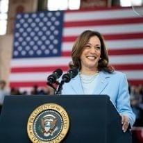 Photo of Vice President Kamala Harris behind a podium.