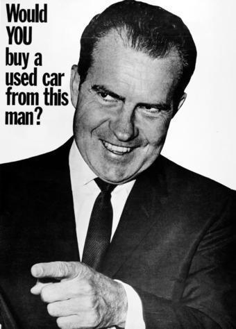 Classic presidential campaigh ad from John F Kennedy's 1960 campaign against Nixon; it's a picture of Nixon looking smarmy with a shit eating grin while pointing at someone off camera in black in white. In the upper left hand corner is the phrase in block lettering:

Would YOU buy a used car from this man?