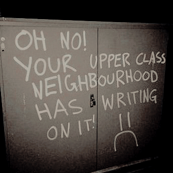 graffiti on a power box thingy that says "oh no! your upper class neighborhood has writing on it! :("