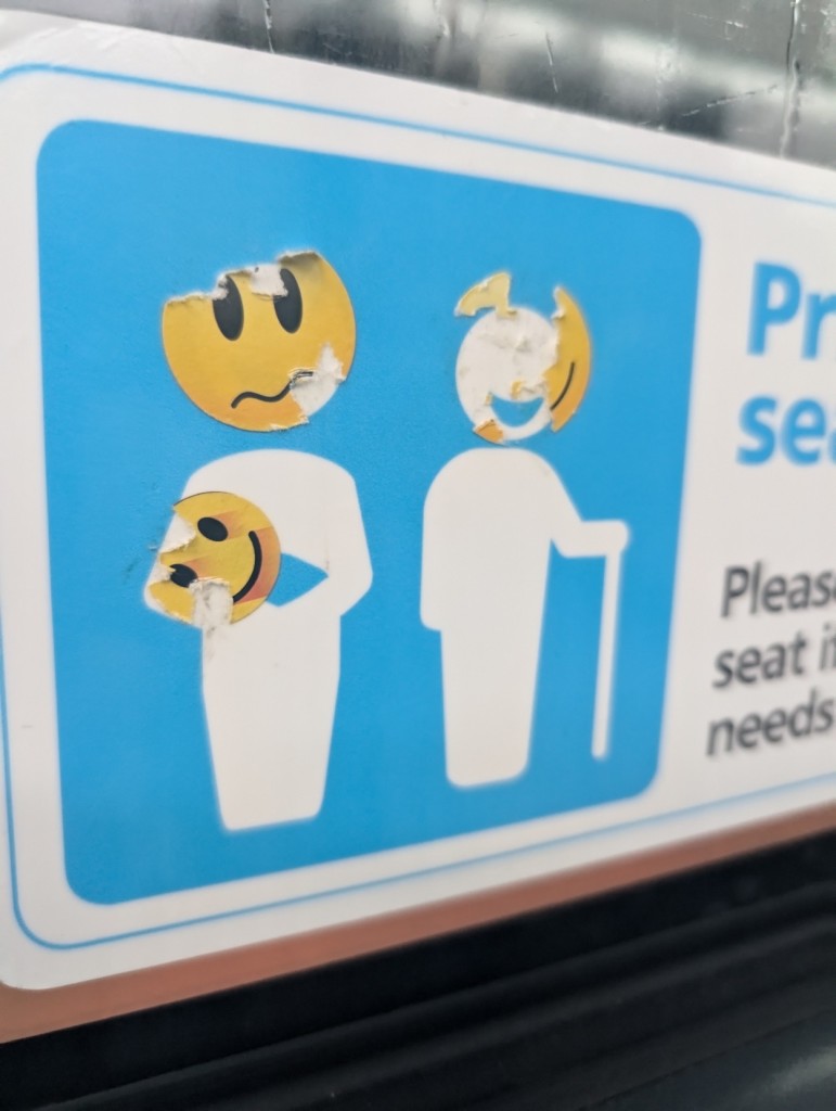 Bus window stick with sad face