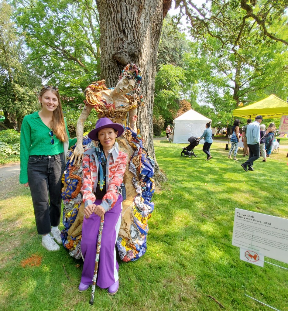 Me & Cassidy with an amazing recycled art sculpture throne seat - sculpted into a woman wearing a ballgown. I'm sitting in it & Cassidy is behind me.