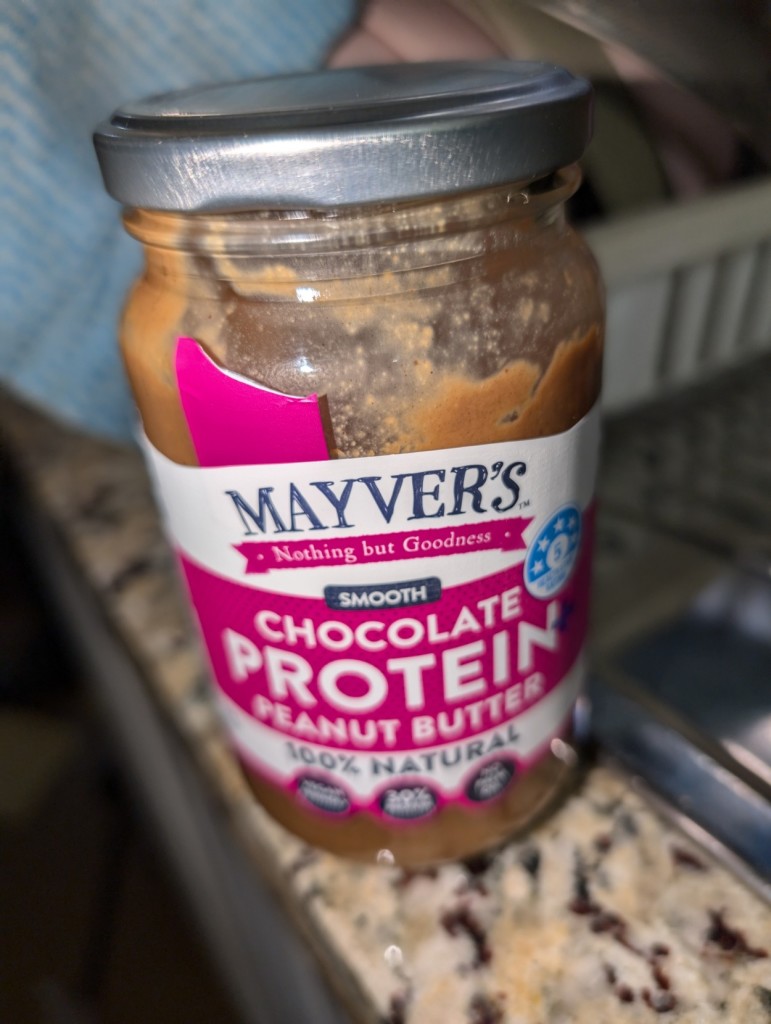 Jar of Mayver's chocolate protein and some thing about peanut butter too