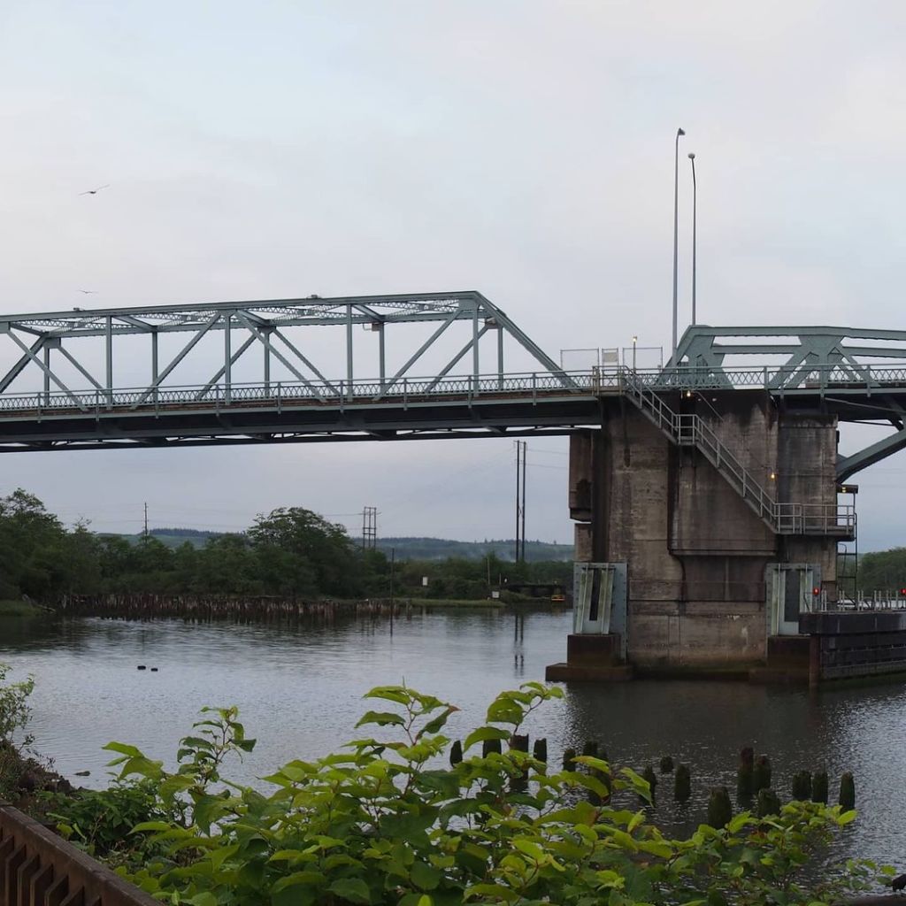 Photo by Neil E. Hodges on November 22, 2020. Image may contain: sky, bridge, plant, outdoor, water and nature.