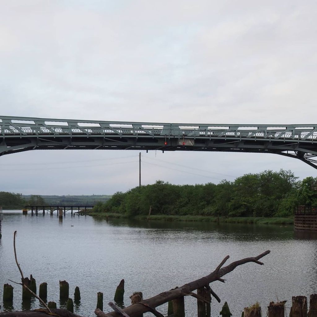 Photo by Neil E. Hodges on November 22, 2020. Image may contain: bridge, sky, plant, tree, outdoor, water and nature.