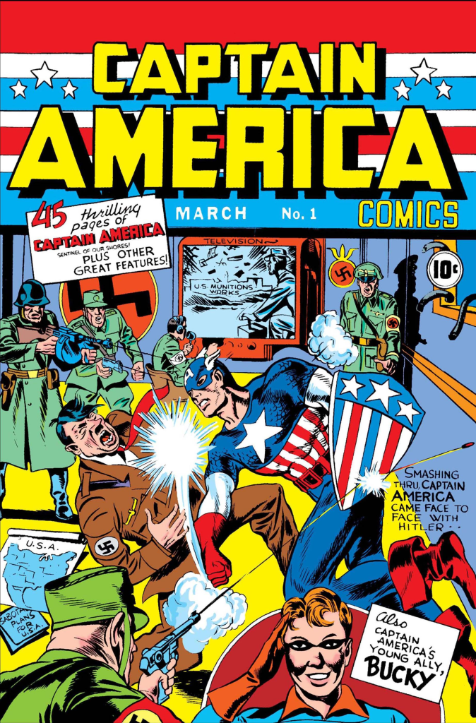 A cover of the first Captain America comic book.

The title of the comics appears on top in large yellow angular letters. The scene depicts the titular hero punching Adolf Hitler.

Captain America is wearing a brightly colored superhero costume that consists of a blue shirt with a large start across the chest and vertical red and white stripes below it, and is also wearing red gloves, a blue mask covering the top half of his face, with little wings attached to the side of the mask. He is also holding a shield for protection.

Hitler is wearing a brown Nazi uniform, and looks visibly in pain. Good.

There is a small crowd of Nazi soldiers looking on helplessly. One of them is attempting to shoot at Captain America, but the bullet hits the shield he's carrying.