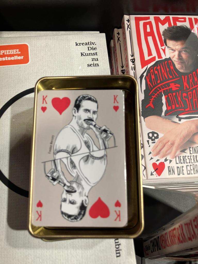 A card set featuring famous musicians and Freddie Mercury is on a picture for the King card. 