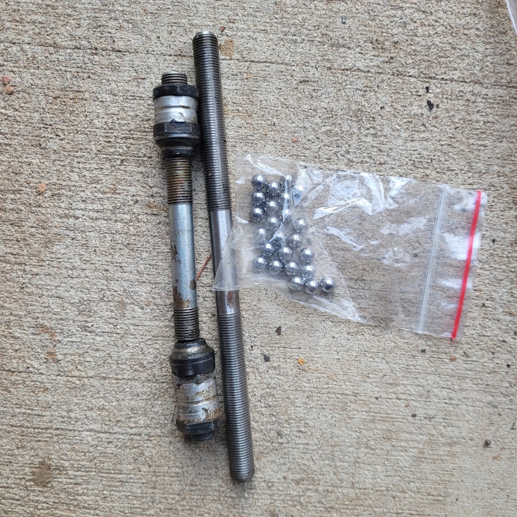 Broken axle, new solid axle which is too long, bearings.