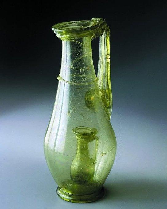 A 4th Century AD, Roman Glass Jug with a smaller glass jug inside; a so called joke jar that shows the skill of the glassmaker