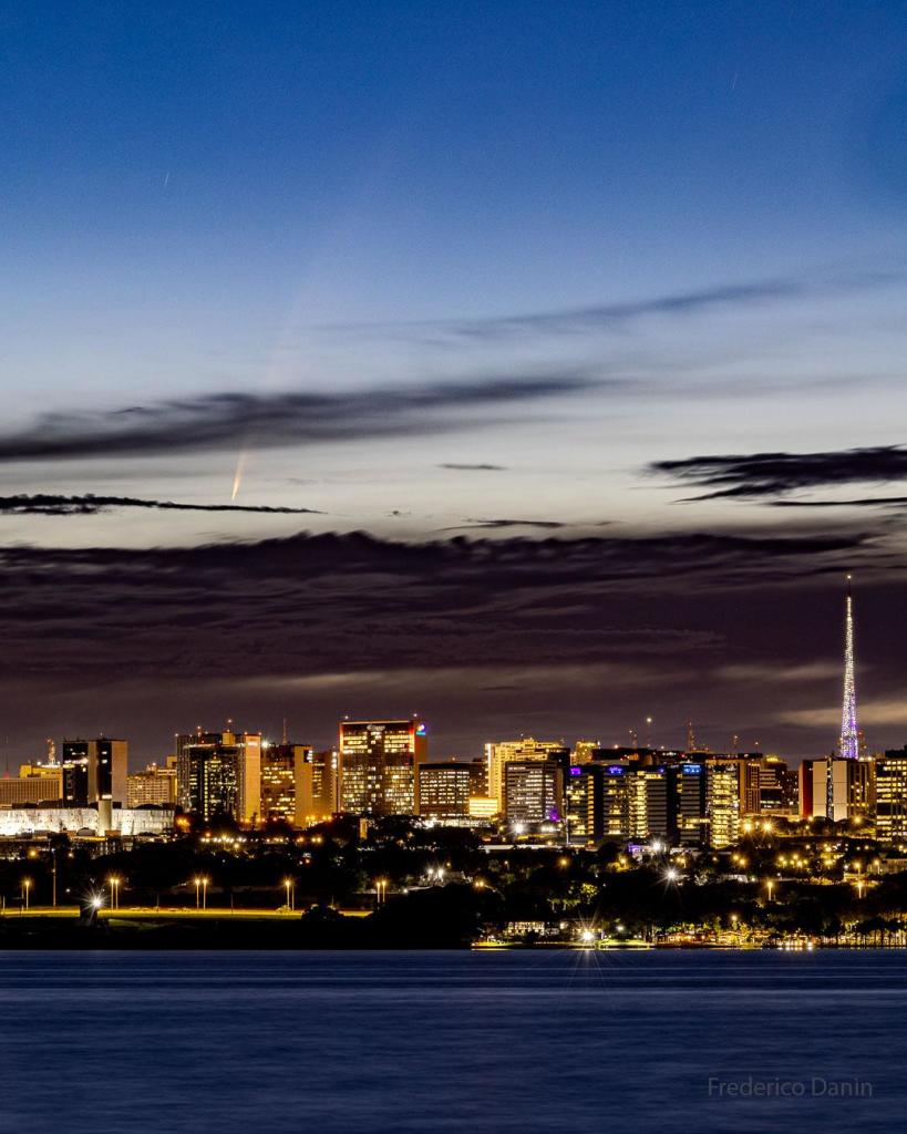 Image of Comet C/2024 G3 (ATLAS) over an urban skyline in Brasilia, Brazil.