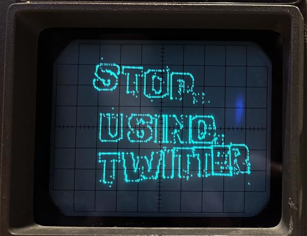 An oscilloscope with the words STOP USING TWITTER drawn in cyan outlines. 