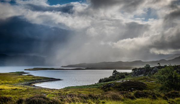 Sun and rain and wind over the sea.