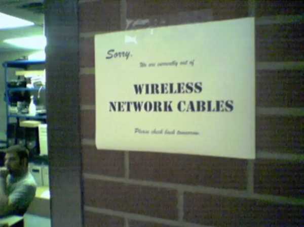 A sign on a brick wall outside of the IT help desk at Westminster College says, "Sorry, we are currently out of wireless network cables. Please check back tomorrow."