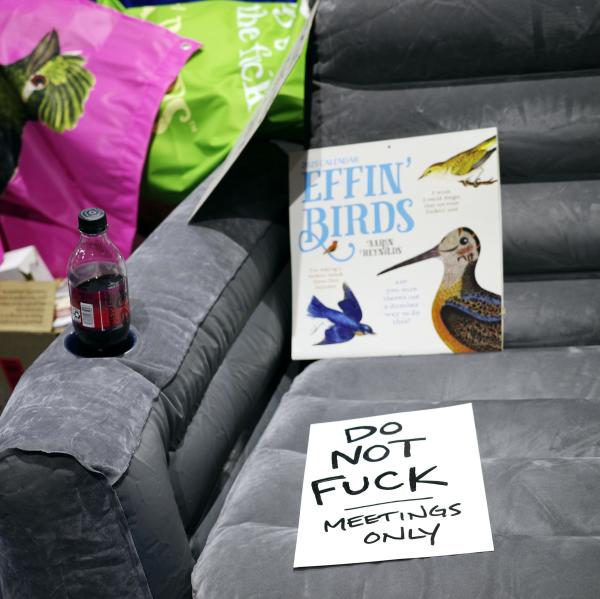 a hand written sign on a couch that reads "do not fuck, meetings only"