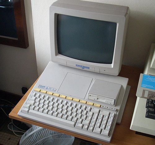 Olivetti Prodest PC1. A CGA monitor and the "CPU unit" that shows a very attractive "wedge" design (the computer *is* the keyboard), not that common in PCs.

(not my PC1)