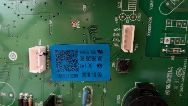 Close up of the fridge circuit board showing the "UART for Test" and "WIFI" pin headers