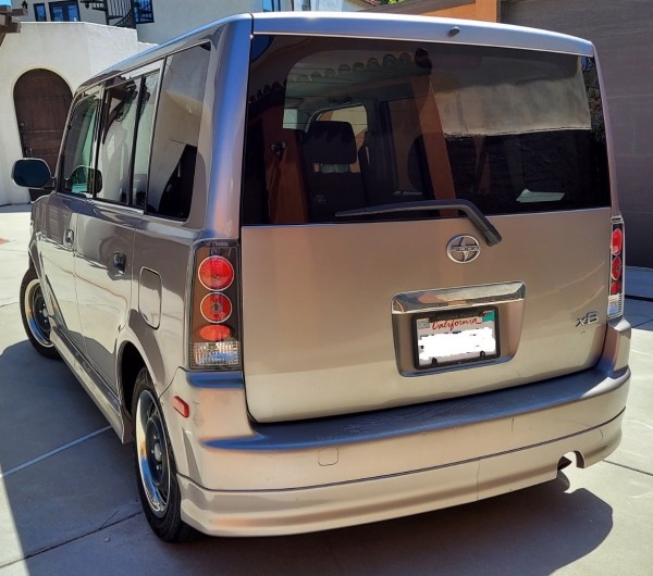 Rear 3/4 view of 2006 Scion xB in Arctic Silver