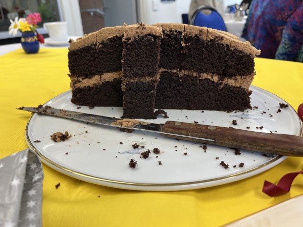 The same chocolate cake as in the previous image - a close up with most of the cake gone, showing the interior.