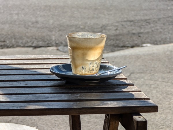 Empty glass of coffee on a timber table