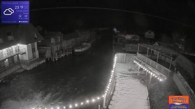 View of the outdoor dining area for The Cove Restaurant and the larger Fishtown complex overlooking a channel leading to Lake Michigan. // Image captured at: 2024-12-19 10:23:10 UTC (about 11 min. prior to this post) // Current Temp in Leland: 23.02 F | -4.99 C // Precip: overcast clouds // Wind: NNW at 4.496 mph | 7.23 kph // Humidity: 80%