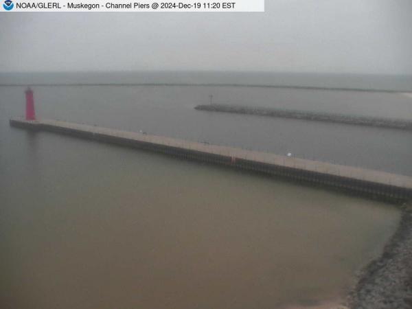 View of Muskegon Channel piers jutting out into Lake Michigan. // Image captured at: 2024-12-19 16:20:01 UTC (about 13 min. prior to this post) // Current Temp in Muskegon: 29.34 F | -1.48 C // Precip: light snow // Wind: ESE at 9.999 mph | 16.09 kph // Humidity: 78%