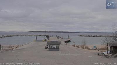 A small security building in the foreground leading into the Liberty Grove ferry docking area and Lake Michigan in the background. // Image captured at: 2024-12-19 18:31:26 UTC (about 1 min. prior to this post) // Current Temp in Liberty Grove: 25.18 F | -3.79 C // Precip: overcast clouds // Wind: ENE at 8.053 mph | 12.9 kph // Humidity: 80%