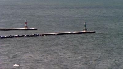 Telescopic view looking southwest onto the Holland pierheads jutting into Lake Michigan off Holland State Park. // Image captured at: 2024-12-20 16:35:53 UTC (about 27 min. prior to this post) // Current Temp in Holland: 30.26 F | -.97 C // Precip: overcast clouds // Wind: NE at 9.999 mph | 16.09 kph // Humidity: 86%