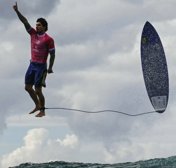 Image of Brazil's Gabriel Medina at the Olympics in 2024. The photo by Jérôme Brouillet captured the athlete in a moment of victory.