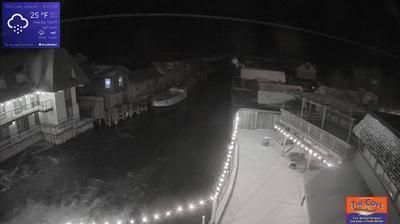 View of the outdoor dining area for The Cove Restaurant and the larger Fishtown complex overlooking a channel leading to Lake Michigan. // Image captured at: 2024-12-21 01:25:37 UTC (about 9 min. prior to this post) // Current Temp in Leland: 24.03 F | -4.43 C // Precip: overcast clouds // Wind: NNW at 22.123 mph | 35.60 kph // Humidity: 74%