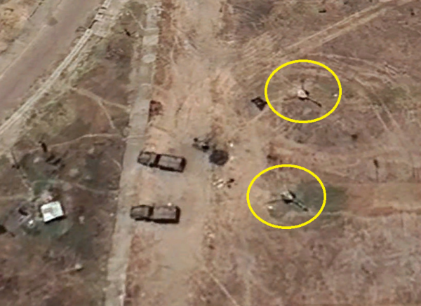 Satellite imagery shows two Soviet origin D30 howitzer artillery guns encircled in yellow. Two miltary trucks are parked near them. This is located just outside the Woldia Stadium main gate.