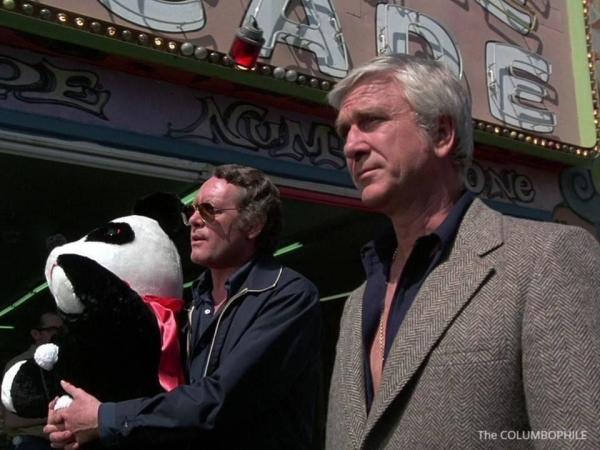 Patrick McGoohan (friend of Peter Falk) and Leslie Neilson stride down a 1970s  Columbo broadwalk and towards the undiscovered country that is....the Weekend. 

Patrick is holding a stuffed panda. 