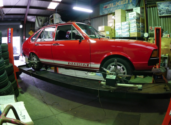 VW Passat on a hoist getting new toyo R888s fitted