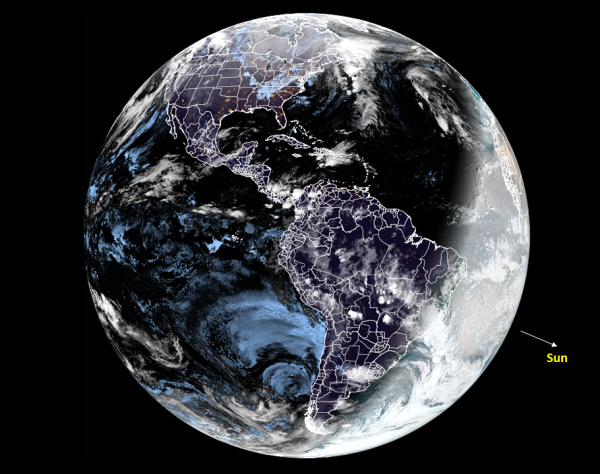 Color image of earth taken by NOAA satellite GOES-16 at the minute when the Northern Hemisphere reached its maximum tilt away from the sun.

The sun is located at an angle of 23.5 degrees from earth towards east and south and is lighting up a crescent of earth hugging the east coast of S. America.