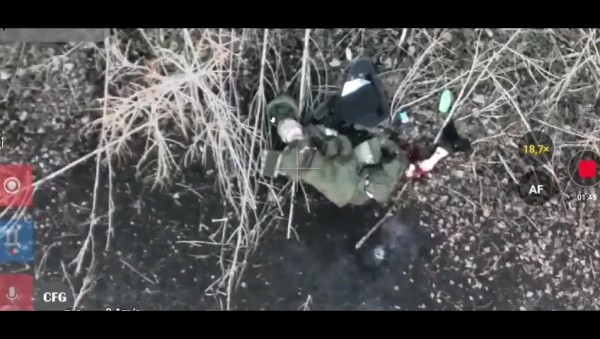 New drone video showing a wounded Russians soldier with mangled legs commiting suicide.