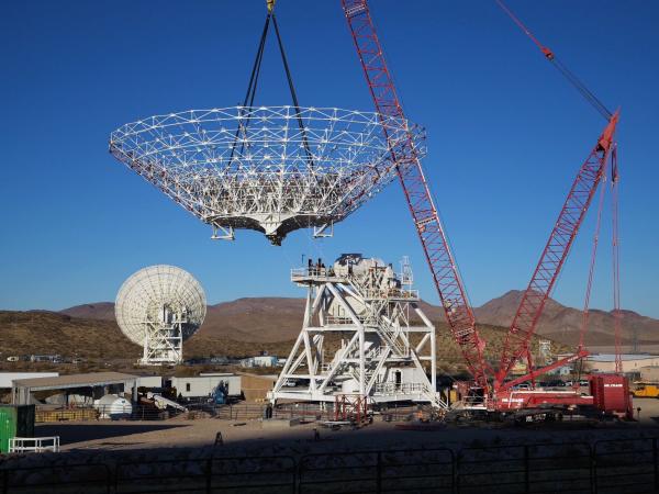 A crane lowers the steel reflector framework for Deep Space Station 23 into position Dec. 18, 2024. Panels will be affixed to the structure create a curved surface to collect radio frequency signals. Credit: NASA/JPL-Caltech