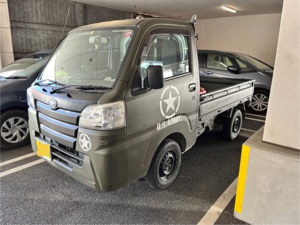 Olive colored Subaru Kei truck with retro US ARMY markings