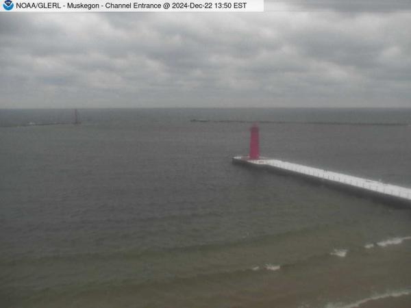 View of Muskegon breakwater in the distance, and the red South Lighthouse defining the entrance of the Muskegon Channel in the foreground. // Image captured at: 2024-12-22 18:50:01 UTC (about 13 min. prior to this post) // Current Temp in Muskegon: 30.49 F | -.84 C // Precip: overcast clouds // Wind: SSE at 9.216 mph | 14.83 kph // Humidity: 71%