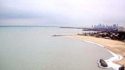 Webcam perched high overlooking Edgewater Beach in Evanston. Chicago skyline visible in the distance. // Image captured at: 2024-12-23 16:19:55 UTC (about 13 min. prior to this post) // Current Temp in Evanston: 37.09 F | 2.83 C // Precip: overcast clouds // Wind: W at 5.995 mph | 9.64 kph // Humidity: 73%