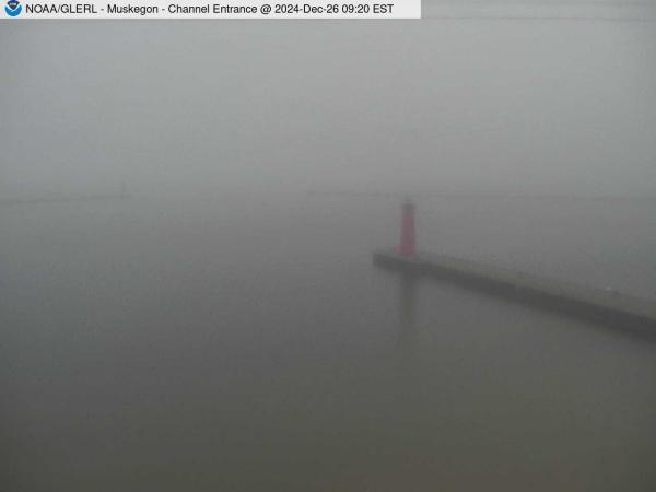 View of Muskegon breakwater in the distance, and the red South Lighthouse defining the entrance of the Muskegon Channel in the foreground. // Image captured at: 2024-12-26 14:20:01 UTC (about 13 min. prior to this post) // Current Temp in Muskegon: 36.62 F | 2.57 C // Precip: fog // Wind: SE at 9.216 mph | 14.83 kph // Humidity: 96%