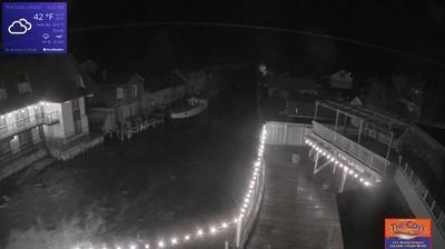 View of the outdoor dining area for The Cove Restaurant and the larger Fishtown complex overlooking a channel leading to Lake Michigan. // Image captured at: 2024-12-27 11:34:08 UTC (about 1 min. prior to this post) // Current Temp in Leland: 39.02 F | 3.90 C // Precip: overcast clouds // Wind: SSE at 11.117 mph | 17.89 kph // Humidity: 99%