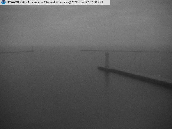 View of Muskegon breakwater in the distance, and the red South Lighthouse defining the entrance of the Muskegon Channel in the foreground. // Image captured at: 2024-12-27 12:50:01 UTC (about 13 min. prior to this post) // Current Temp in Muskegon: 41.79 F | 5.44 C // Precip: overcast clouds // Wind: ESE at 7.001 mph | 11.26 kph // Humidity: 96%