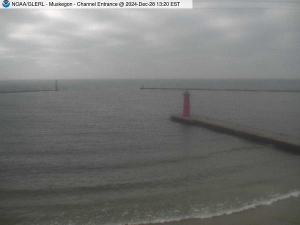 View of Muskegon breakwater in the distance, and the red South Lighthouse defining the entrance of the Muskegon Channel in the foreground. // Image captured at: 2024-12-28 18:20:01 UTC (about 13 min. prior to this post) // Current Temp in Muskegon: 46.50 F | 8.06 C // Precip: scattered clouds // Wind: SSW at 9.999 mph | 16.09 kph // Humidity: 79%