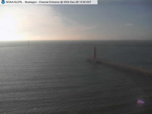 View of Muskegon breakwater in the distance, and the red South Lighthouse defining the entrance of the Muskegon Channel in the foreground. // Image captured at: 2024-12-28 20:50:01 UTC (about 13 min. prior to this post) // Current Temp in Muskegon: 46.79 F | 8.22 C // Precip: scattered clouds // Wind: SSW at 18.410 mph | 29.62 kph // Humidity: 78%