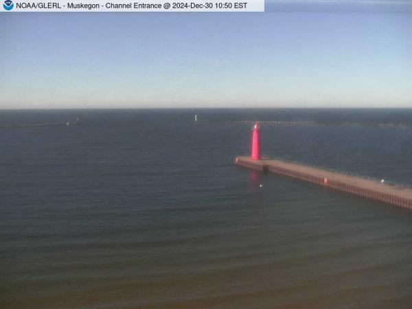 View of Muskegon breakwater in the distance, and the red South Lighthouse defining the entrance of the Muskegon Channel in the foreground. // Image captured at: 2024-12-30 15:50:01 UTC (about 13 min. prior to this post) // Current Temp in Muskegon: 42.02 F | 5.57 C // Precip: broken clouds // Wind: W at 5.010 mph | 8.06 kph // Humidity: 78%