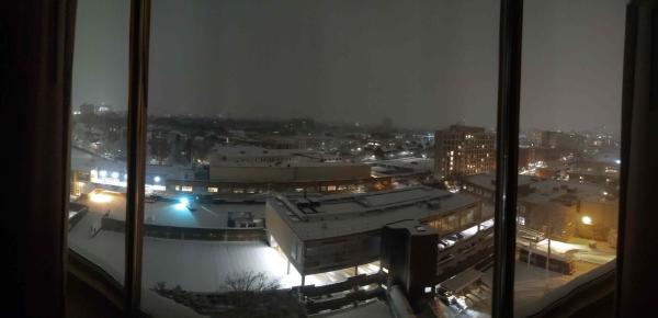 a nighttime half-panorama view of Cambridge from a 12th floor hotel window. The entire landscape is covered in about 8" of new snow